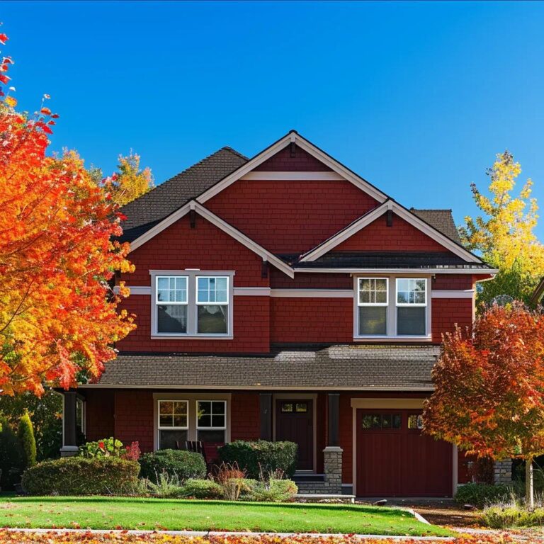 Freshly painted house in autumn colors surrounded by fall foliage